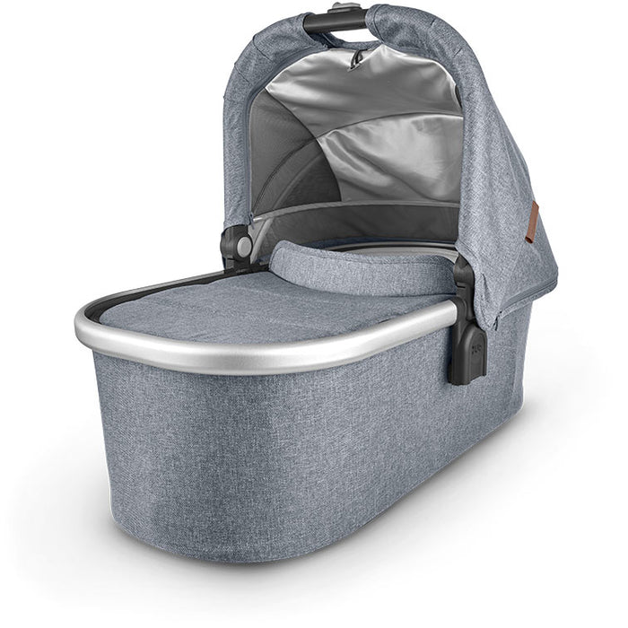 caption-Gregory Uppababy bassinet for stroller use in peaceful blue melange fabric on canopy and body of bassinet plus zippered overlay. Silver metal framing to coordinate with stroller frame is exposed at upper part of bassinet