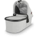 caption-Anthony Uppababy bassinet for stroller use in white fabric on canopy and body of bassinet plus zippered overlay. Black metal framing to coordinate with stroller frame is exposed at upper part of bassinet