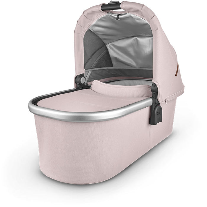 caption-Alice UPPAbaby Bassinet in Alice Pink and silver metal exposed on upper bassinet framing