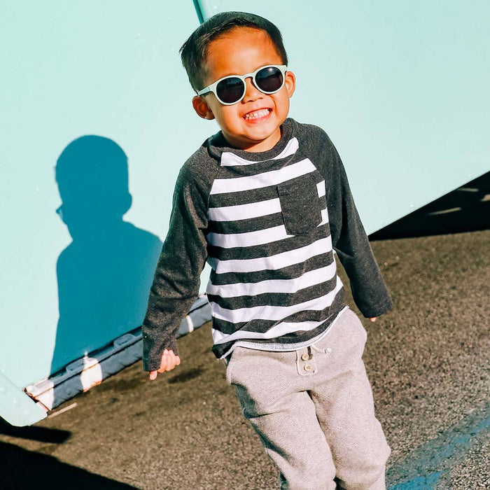 caption-Child in sunshine wearing Babiators Keyhole Sunglasses