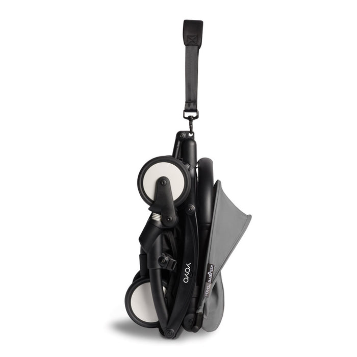 caption- Compact fold of Babyzen Yoyo2 Stroller with carry strap