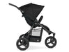 Side view of Bumbleride Indie Stroller with 3 large wheels, roomy basket. Seat is shown upright on the black frame.