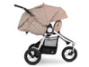 Fully reclined 3 wheeled bumbleride stroller with silver frame and sand coloured canopy and seat. The leg rest is adjusted upward to enclose the look and feel of a bassinet. 