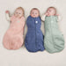 caption-Trio of swaddled babies in Ergo Cocoon Pouch