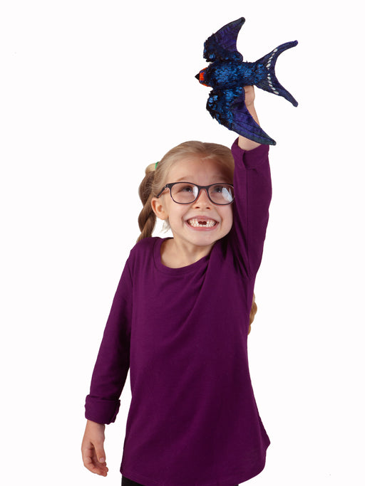 caption-Child plays with Barn Swallow Bird Puppet by Folkmanis