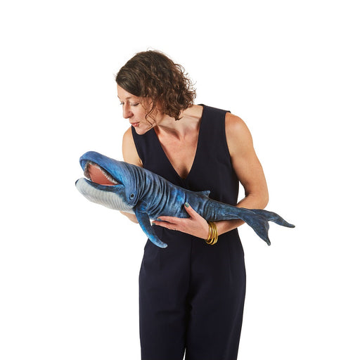 caption-Puppeteer holds Blue Whale Puppet by Folkmanis