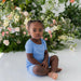 caption-child wearing Kyte Baby Short Sleeve Bamboo PJ Set in Periwinkle