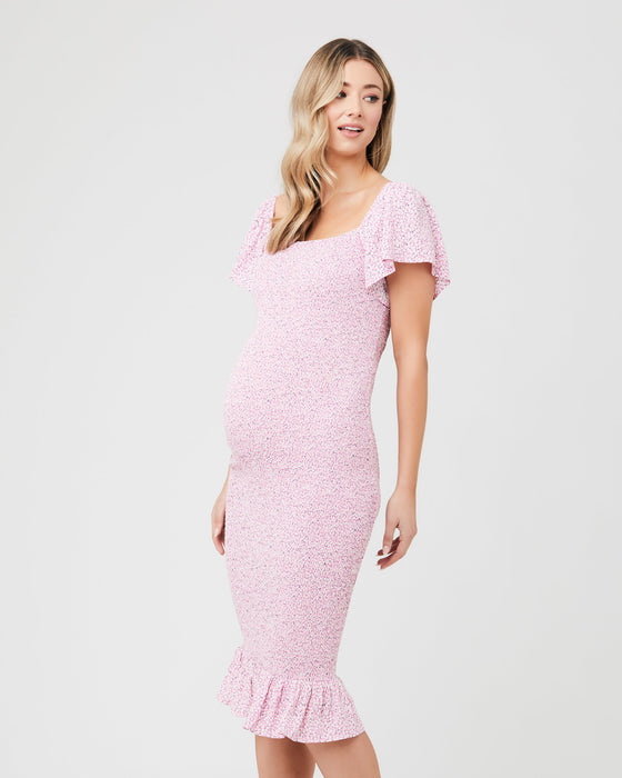 caption-Form flattering pink maternity dress with flutter sleeves