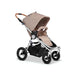 Bumbleride Era Stroller profile in light netural Dune fabric seat and canopy with  showing large rear air-filled tires roomy storage basket, spacious seat with padded bumper bar and cork handlebar. A white and dune checkered interior is shown on the underside of the canopy